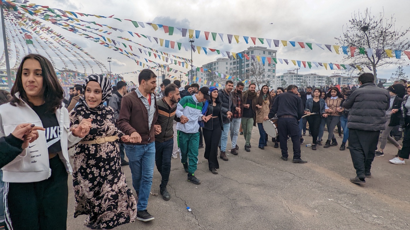 A govend dance line at Newroz — hands linked, moving as one
